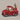 Red toy truck with Santa Claus and reindeer on a dark background