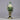 Decorative nutcracker figure with green and gold colors on a dark background