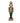 A decorative Christmas nutcracker figurine standing on a snowy surface at night, with blurred holiday lights and a dark outdoor background. The nutcracker wears a red coat with green trim, black pants, and a gold-and-black hat, and stands on a red and gold base.
