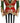 A decorative nutcracker figurine standing on a round base, with a black and white striped body, red and gold ornate jacket, green sleeves, and a black and gold hat.