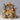 Nativity scene figurine with Mary, Joseph, and baby Jesus on a dark background