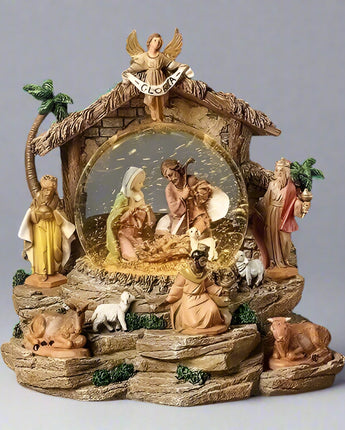 Nativity scene figurine with Mary, Joseph, and baby Jesus on a dark background