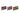 Three Christmas train ornaments in blue, red, and green, hanging side by side against a plain white background.